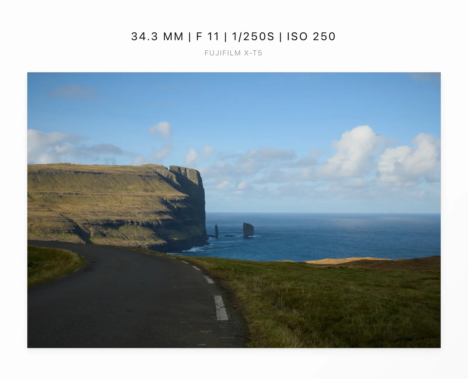 A coastal road framed in Overline