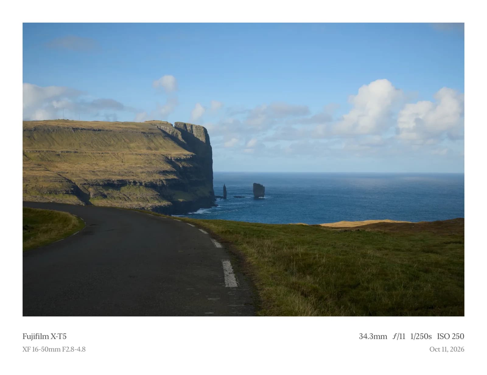 A coastal road framed in Two Columns