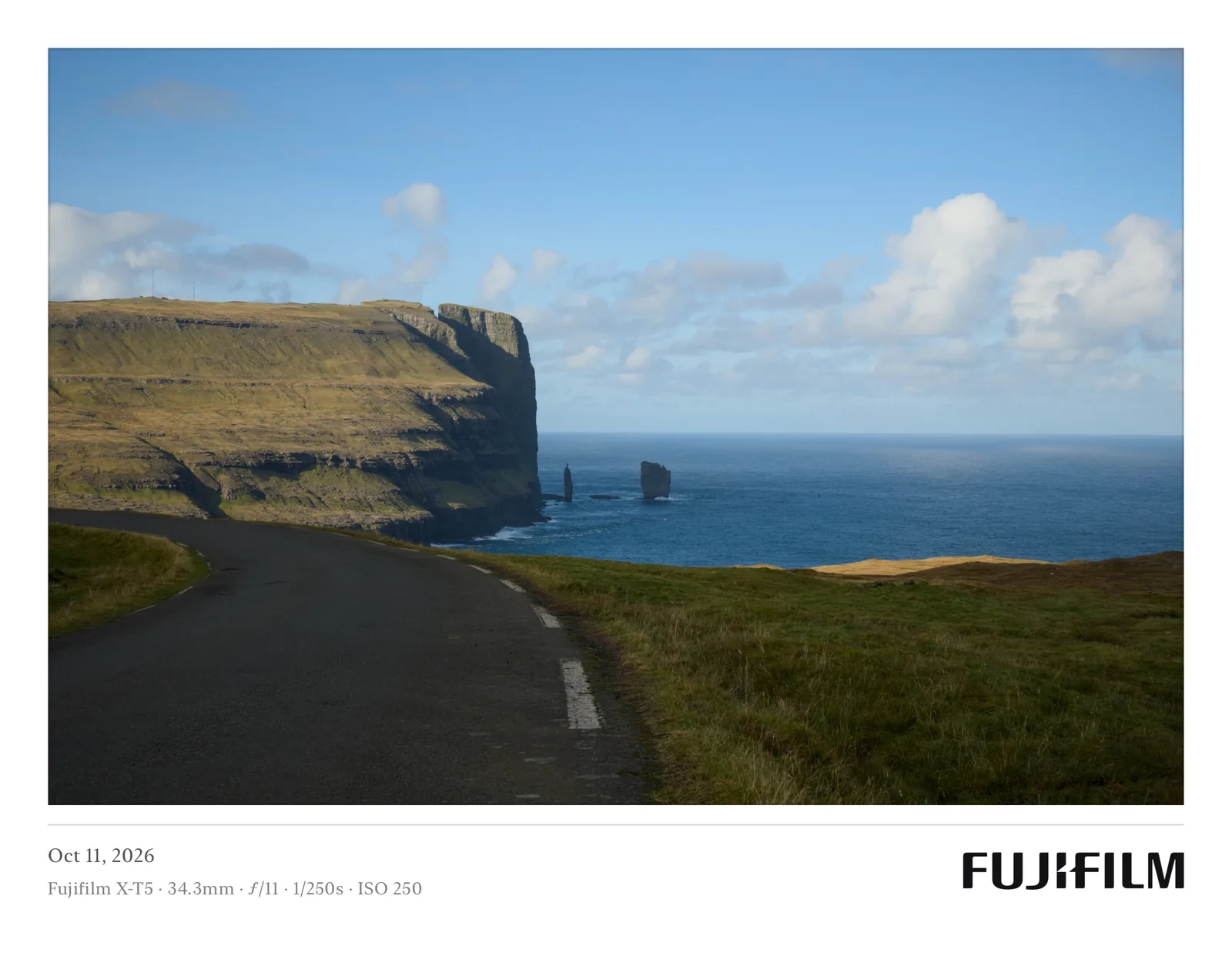 A coastal road framed in Postcard